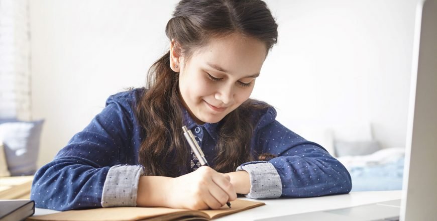 learning-education-leisure-hobby-modern-technologies-cheerful-positive-teenage-girl-sitting-desk-her-room-making-notes-her-diary