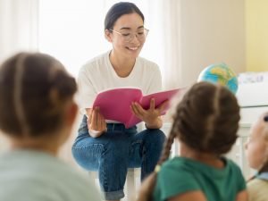 front-view-woman-reading-something-her-students